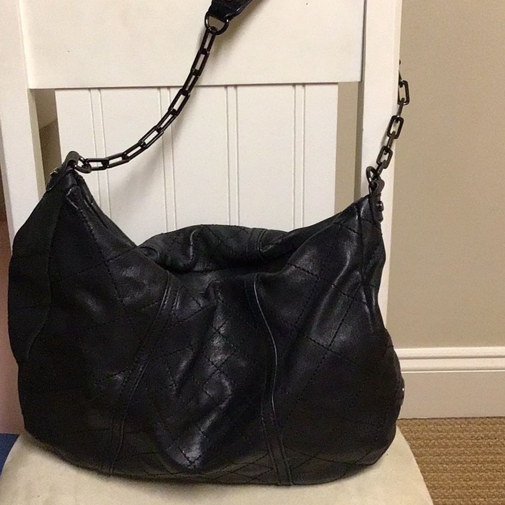 Tory Burch quilted leather purse with gun metal chain strap.